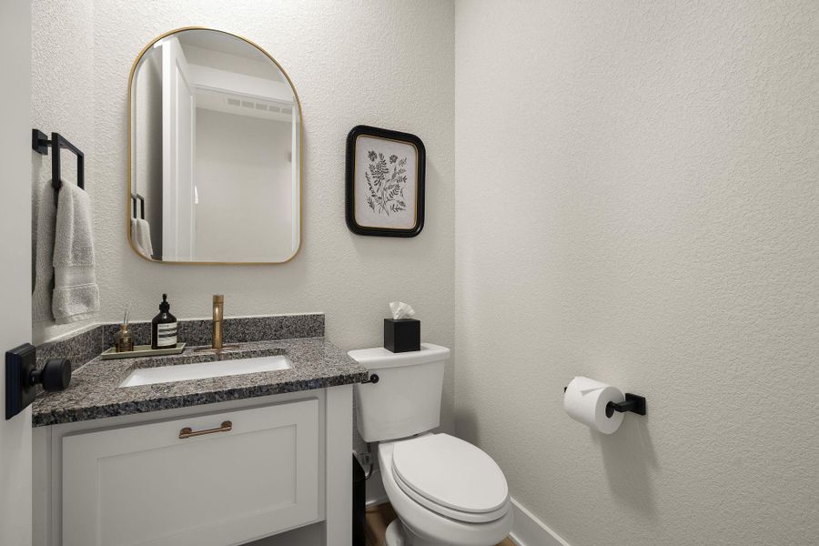 Chic powder bath with modern fixtures.