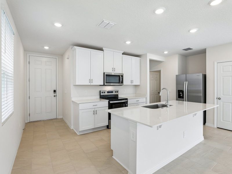 Furnished interior view inside a new home in The Meadow at Crossprairie Townes, St. Cloud (Image 3).