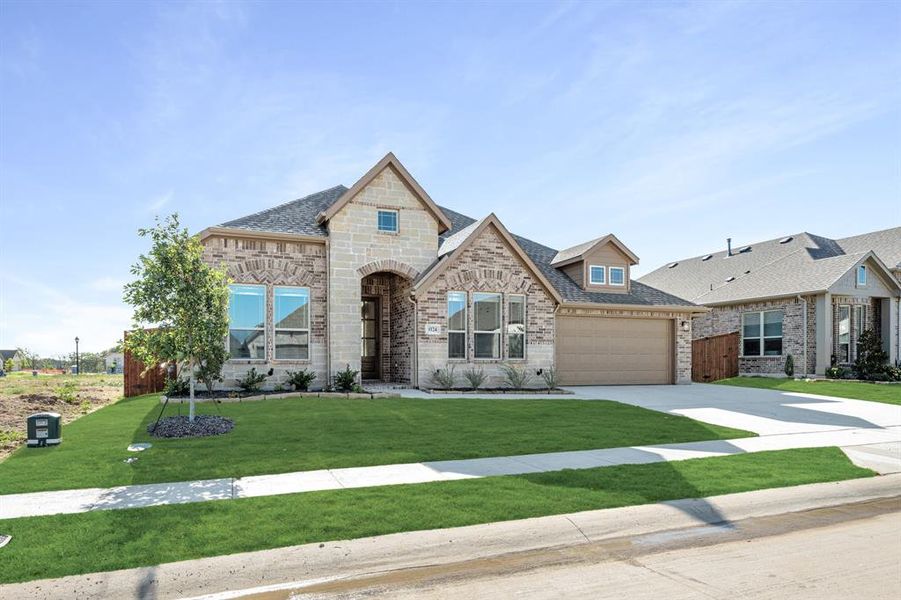 Front exterior of a new home in Timberbrook 3B-4A, Justin, TX, highlighting curb appeal (Image 1).