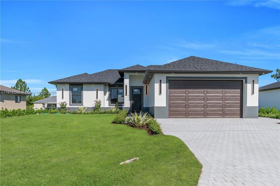 Front exterior of a new home in , Lehigh Acres, FL, highlighting curb appeal (Image 23). Front exterior of a new home in , Lehigh Acres, FL, highlighting curb appeal (Image 23).