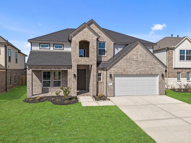 Front exterior of a new home in Barton Creek Ranch, Conroe, TX, highlighting curb appeal (Image 19).