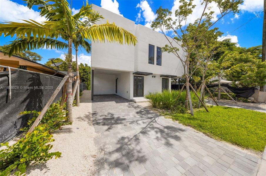 Front exterior of a new home in , Miami, FL, highlighting curb appeal (Image 1).