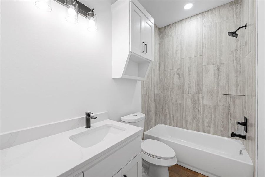 Full bath featuring bathtub / shower combination and vanity Full bath featuring bathtub / shower combination and vanity