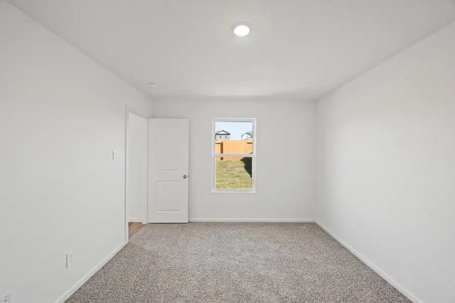 Spacious, unfurnished interior of a new home in The Canopies, Splendora (Image 12).