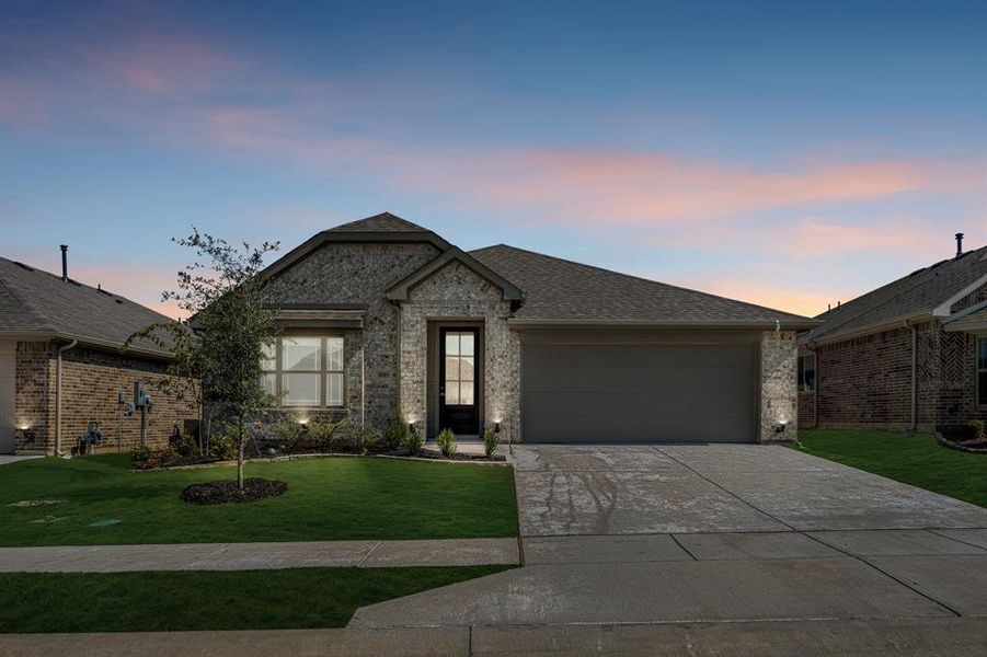 Front exterior of a new home in Eagle Glen Elements, Alvarado, TX, highlighting curb appeal (Image 1).