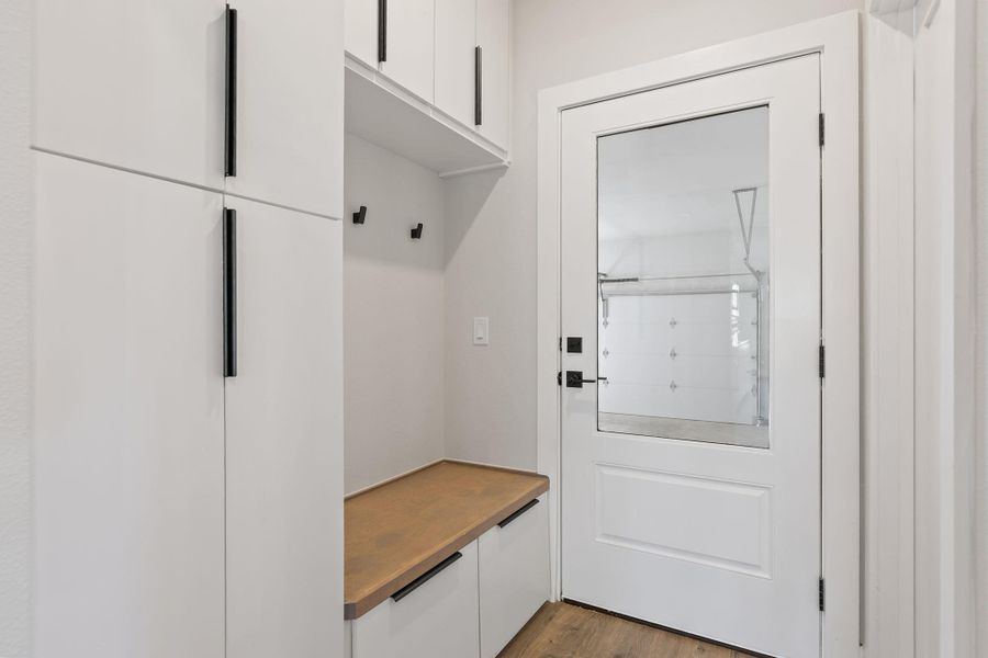 Mudroom with wood finished floors