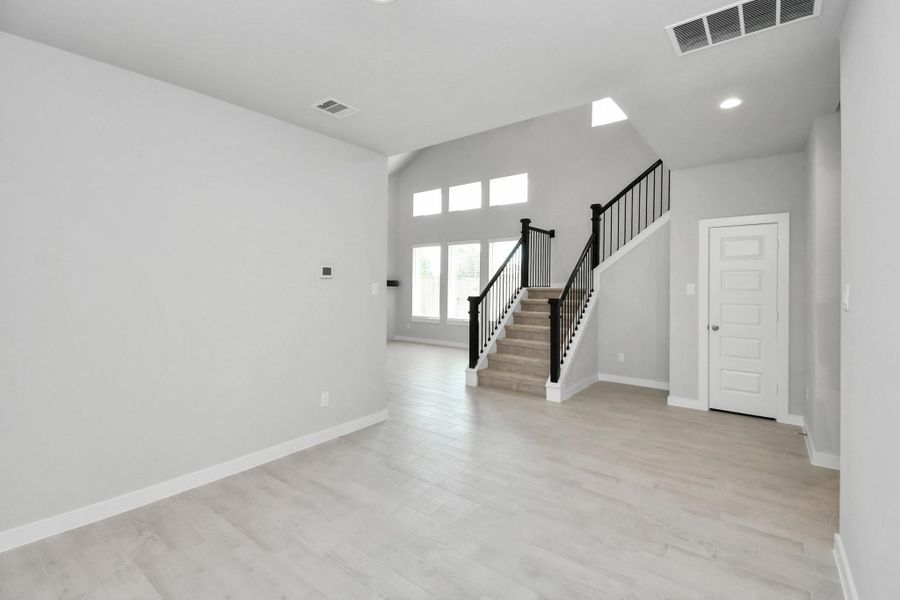 View from the dining room to the staircase. Sample photo of completed home with similar floor plan. Actual colors and selections may vary. View from the dining room to the staircase. Sample photo of completed home with similar floor plan. Actual colors and selections may vary.