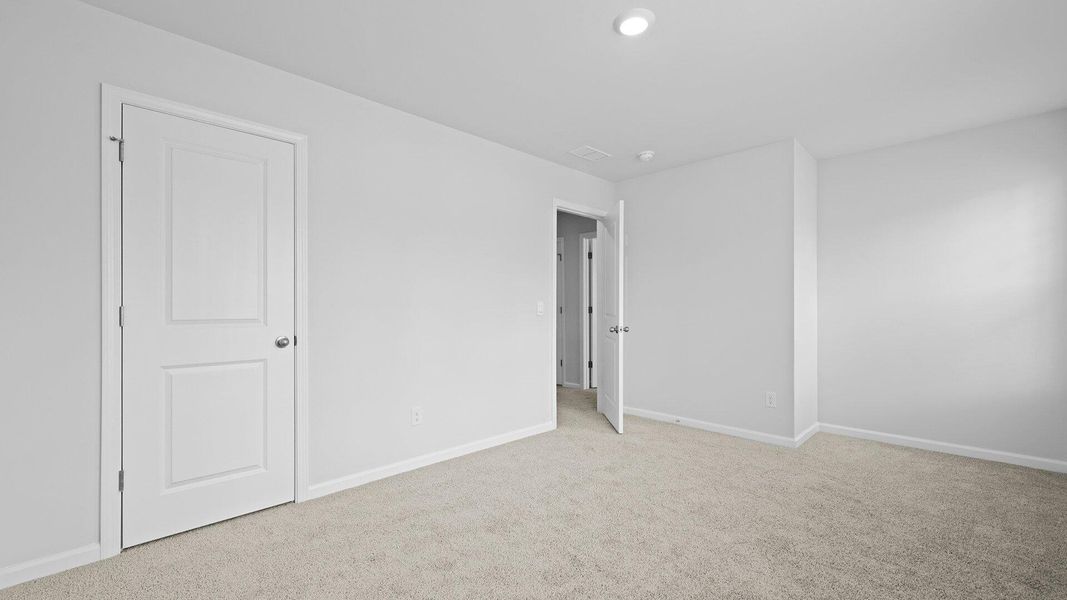 Spacious, unfurnished interior of a new home in Pine Hills Townhomes at Cane Bay, Summerville (Image 24). Spacious, unfurnished interior of a new home in Pine Hills Townhomes at Cane Bay, Summerville (Image 24).