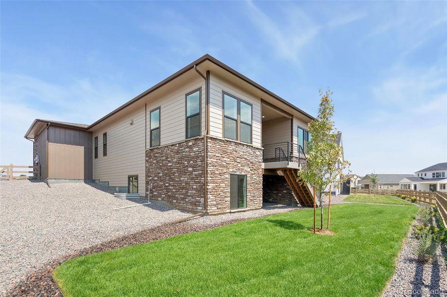 Exterior details and patio area of a home in Kitchel Lake at Serratoga Falls, Timnath (Image 4).