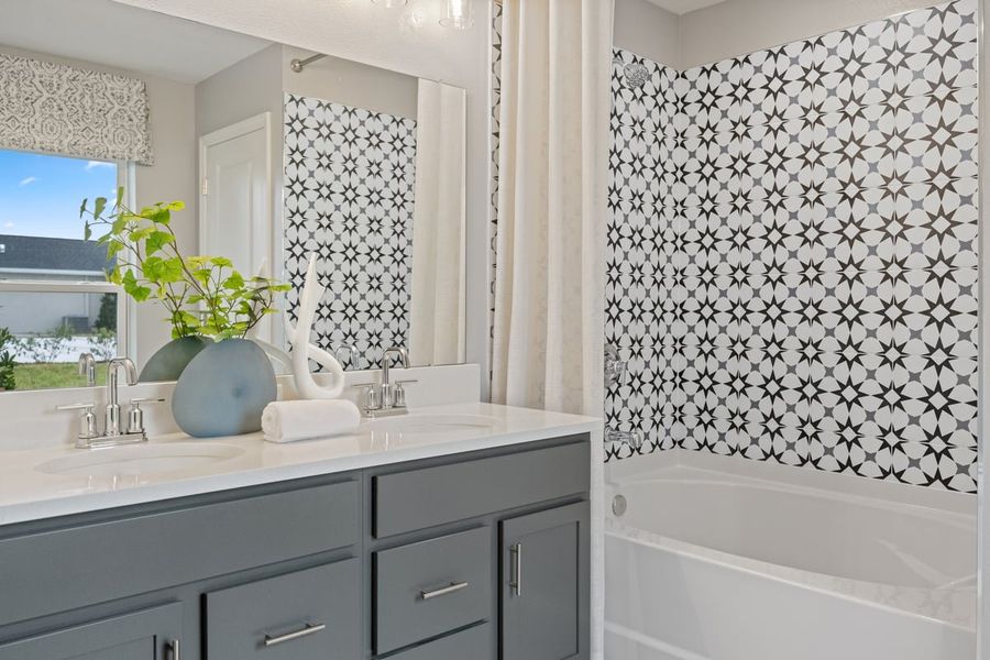 Garden tub with tile surround at primary bath