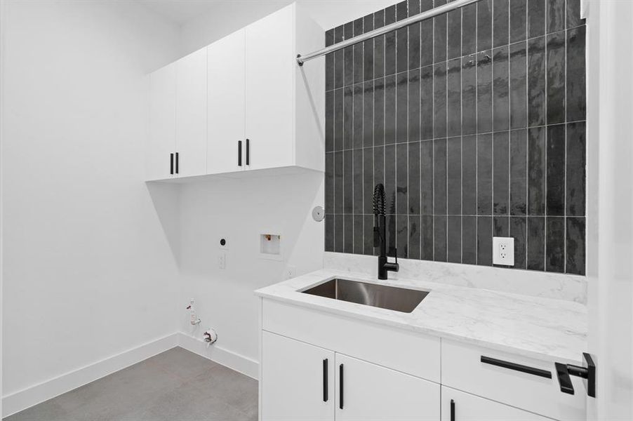 Second floor laundry/utility room provides both beauty and function.