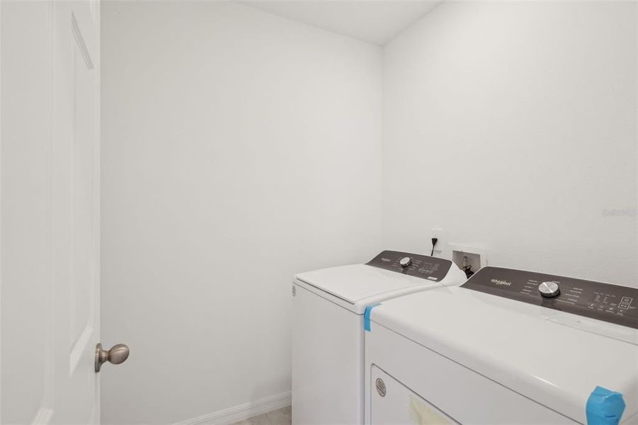 Furnished interior view inside a new home in Lake Deer Estates - Signature Series, Poinciana (Image 8). Furnished interior view inside a new home in Lake Deer Estates - Signature Series, Poinciana (Image 8).