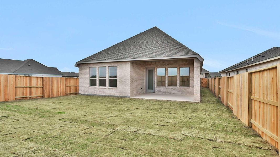 Exterior details and patio area of a home in Meridiana, Manvel (Image 3).