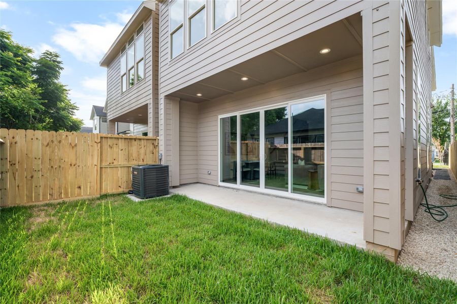 Seamless indoor-outdoor living. Step out onto your covered patio for morning coffee or evening relaxation in a fully fenced, private green space.