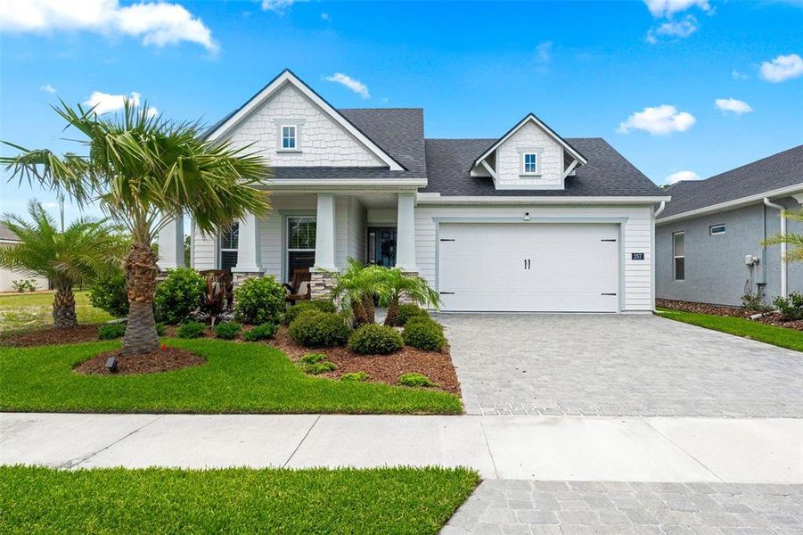 Front exterior of a new home in Mosaic, Daytona Beach, FL, highlighting curb appeal (Image 1). Front exterior of a new home in Mosaic, Daytona Beach, FL, highlighting curb appeal (Image 1).