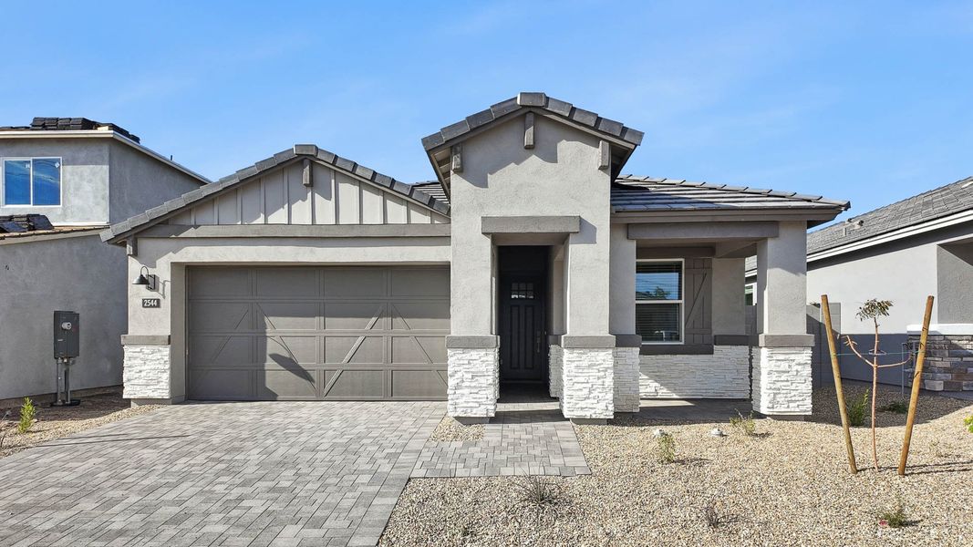 Representative exterior photo of a completed home built from the Hayden by D.R. Horton in The Ridge at Stone Butte, Phoenix, AZ (Image 23).