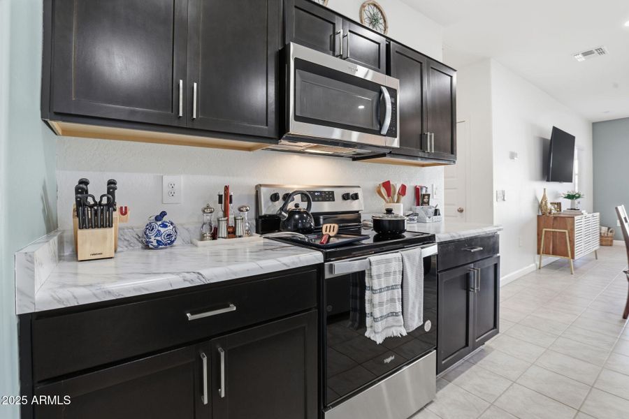 Upgraded dark wood cabinetry throughout