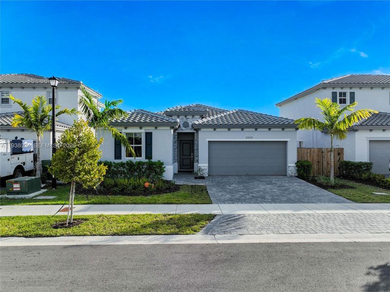 Front exterior of a new home in , Homestead, FL, highlighting curb appeal (Image 26). Front exterior of a new home in , Homestead, FL, highlighting curb appeal (Image 26).