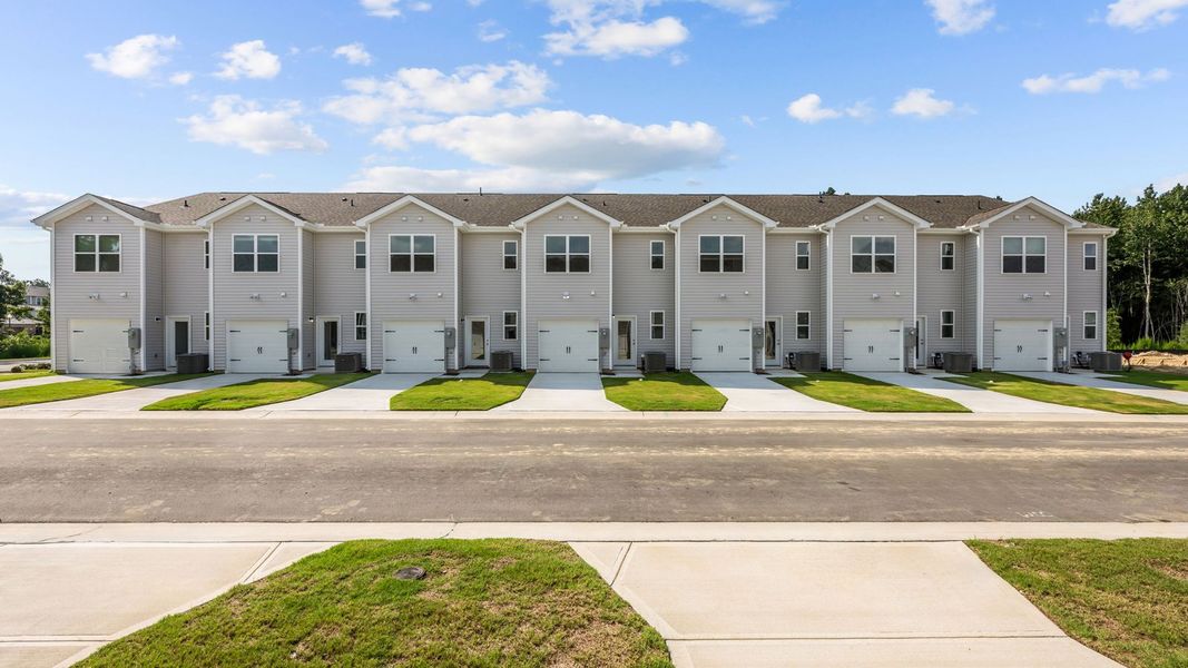 Front exterior of a new home in Clock Road Townhomes, New Bern, NC, highlighting curb appeal (Image 15).