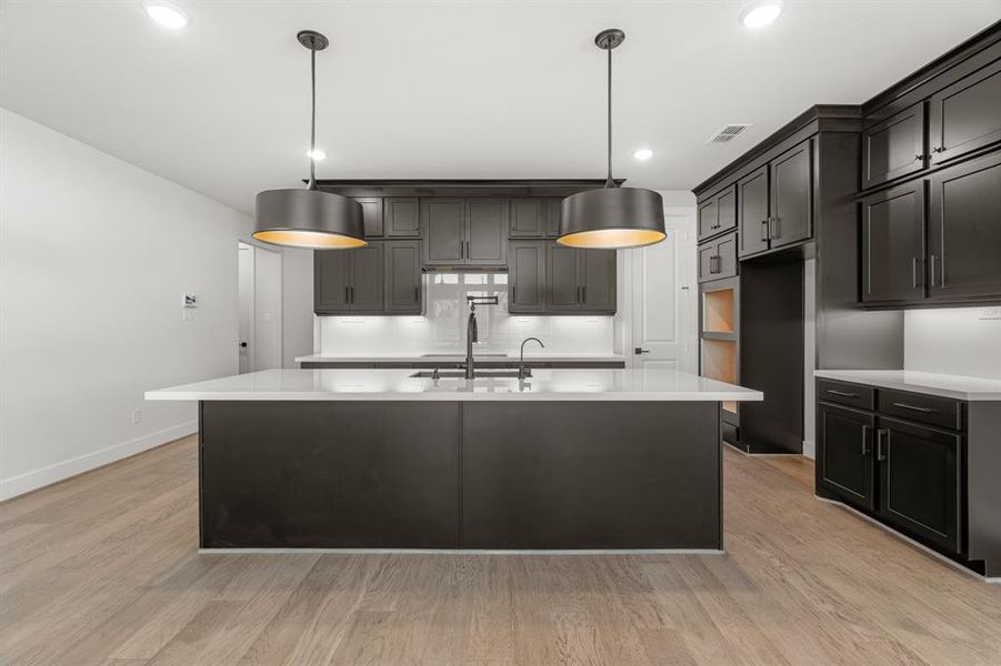 Plenty of counterspace and cabinets in this gourmet kitchen,