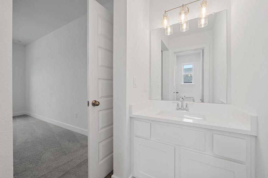 Bathroom with vanity and baseboards Bathroom with vanity and baseboards