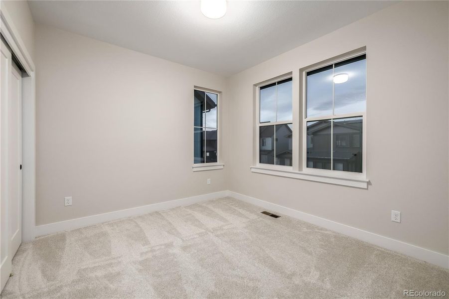 Spacious, unfurnished interior of a new home in West Grange, Longmont (Image 39).