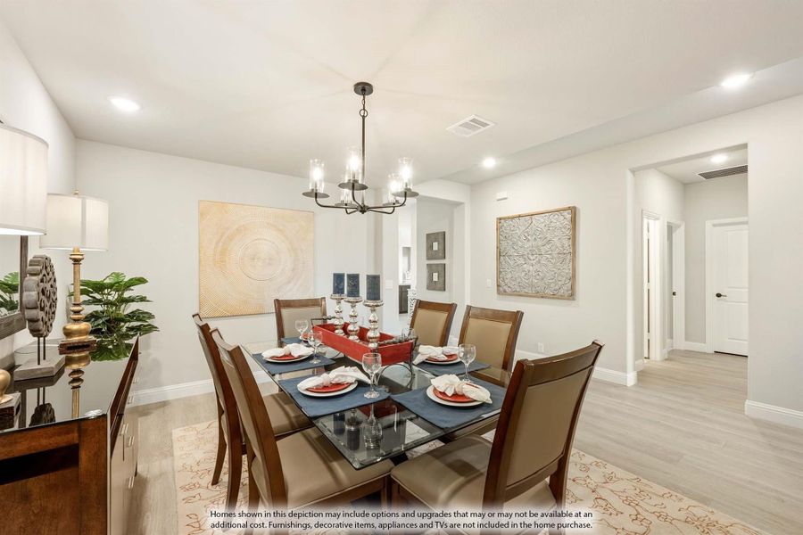 Dining room with glass-top table, six chairs, chandelier, and light hardwood floors Dining room with glass-top table, six chairs, chandelier, and light hardwood floors