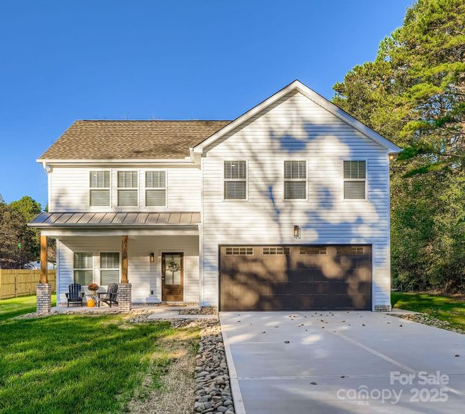 Front exterior of a new home in , Concord, NC, highlighting curb appeal (Image 2). Front exterior of a new home in , Concord, NC, highlighting curb appeal (Image 2).