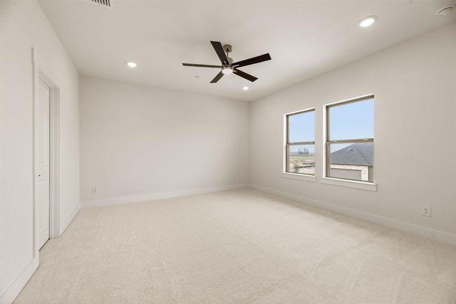 This owner's suite with large windows and neutral colors is the perfect place to relax and unwind at the end of the day. This owner's suite with large windows and neutral colors is the perfect place to relax and unwind at the end of the day.