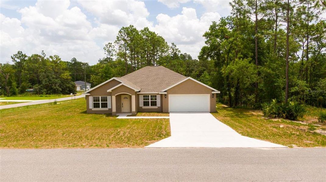 Front exterior of a new home in Marion Oaks, Ocala, FL, highlighting curb appeal (Image 1). Front exterior of a new home in Marion Oaks, Ocala, FL, highlighting curb appeal (Image 1).