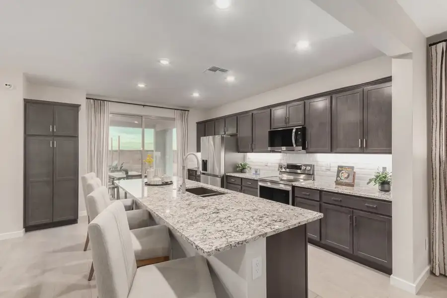 Furnished interior view inside a new home in Avanti at Granite Vista, Waddell (Image 8).