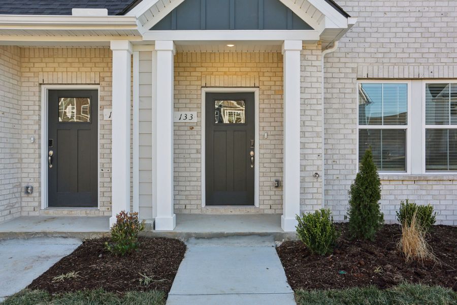 Exterior details and patio area of a home in Greystone - Highland Townhomes, Smyrna (Image 3).