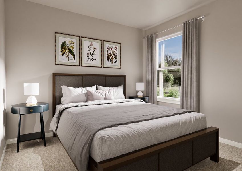 Cozy bedroom featuring a bed, decorative floral prints, a bedside lamp, and a window with soft curtains overlooking greenery.