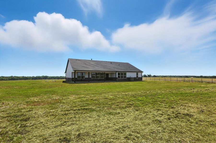 Front exterior of a new home in , Whitesboro, TX, highlighting curb appeal (Image 27). Front exterior of a new home in , Whitesboro, TX, highlighting curb appeal (Image 27).