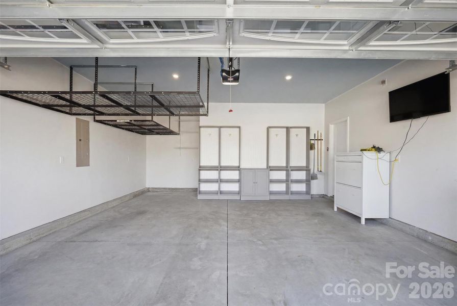 Garage with 2 raised 4'x8' storage racks and custom drop zone. Garage with 2 raised 4'x8' storage racks and custom drop zone.
