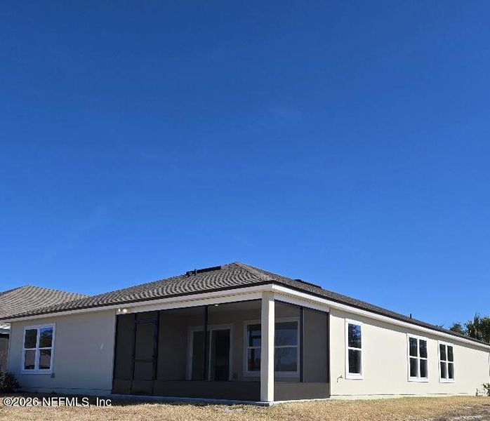 Exterior details and patio area of a home in Freedom at Sawmill Branch, Palm Coast (Image 3).