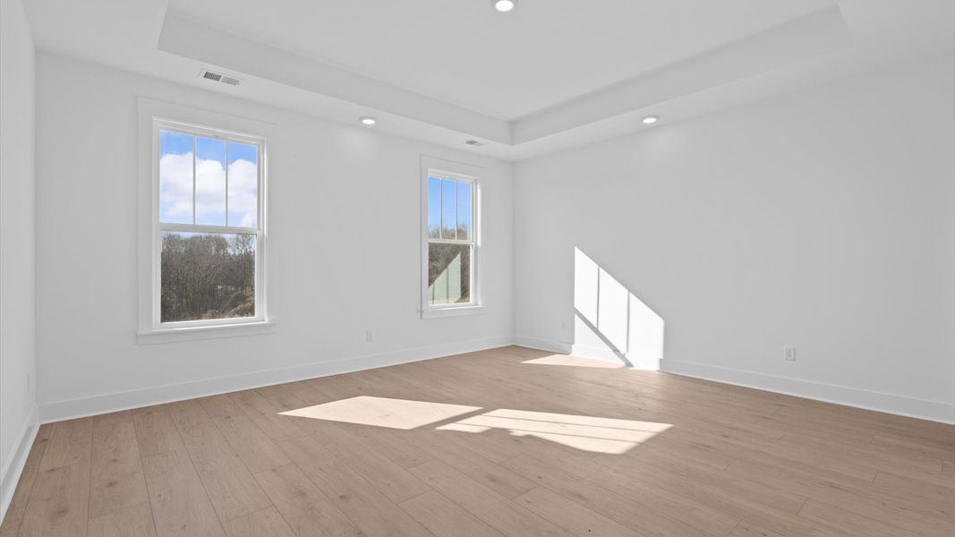 Accomplished design meets restful elegance in this exclusive primary suite by DRB Homes