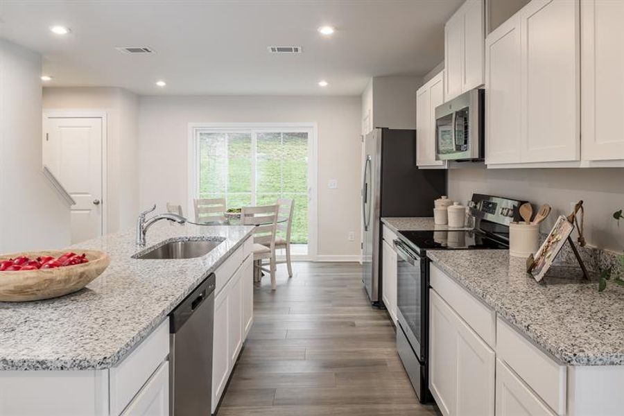 Representative furnished interior of a home built from the Tate by Ryan Homes in Middle Creek Village Coastal Cottages & Villas, Bolivia (Image 5).