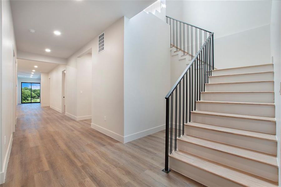 Stairway with light wood-type flooring