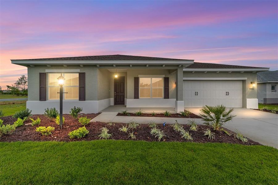 Front exterior of a new home in On Top of the World Communities, Ocala, FL, highlighting curb appeal (Image 19). Front exterior of a new home in On Top of the World Communities, Ocala, FL, highlighting curb appeal (Image 19).