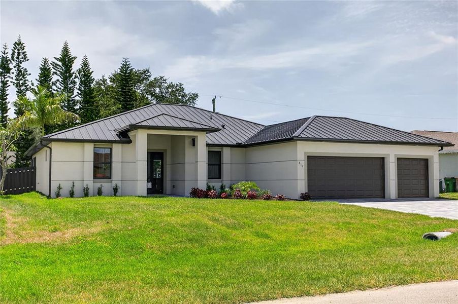 Front exterior of a new home in , Cape Coral, FL, highlighting curb appeal (Image 26).