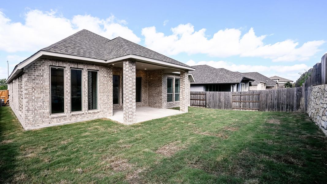 Exterior details and patio area of a home in Crosswinds, Kyle (Image 2).
