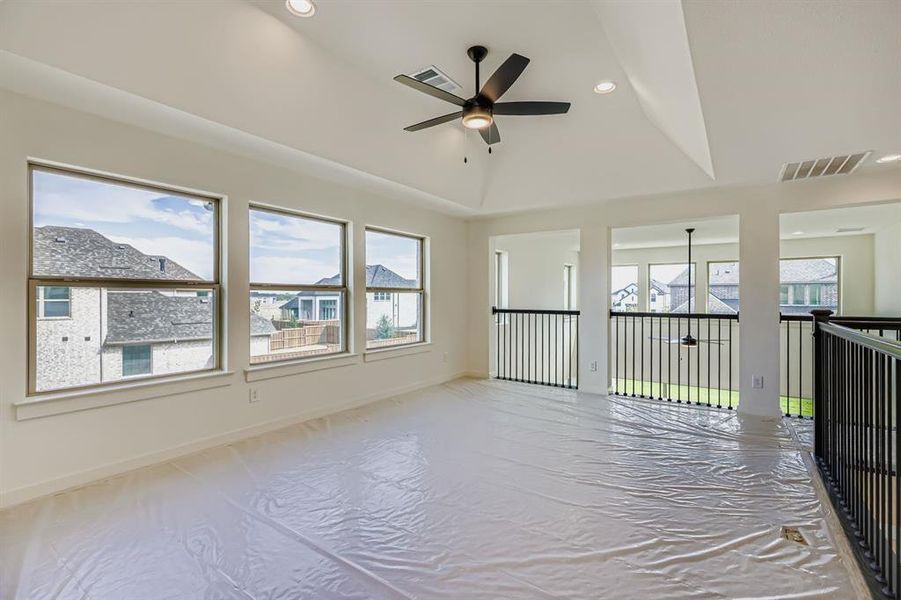 Spare room with ceiling fan, recessed lighting, and a tray ceiling Spare room with ceiling fan, recessed lighting, and a tray ceiling