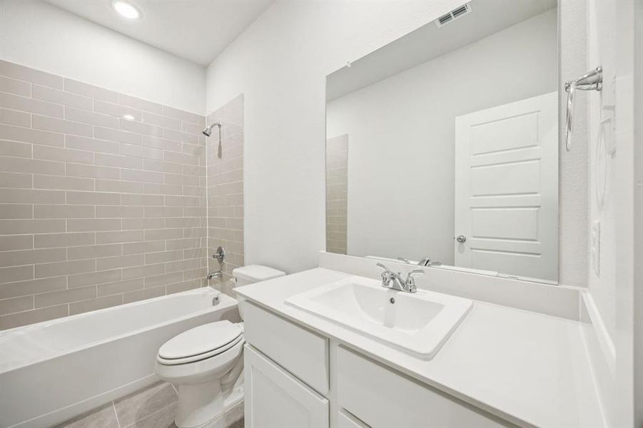 Bathroom in the Masters home plan by Trophy Signature Homes – REPRESENTATIVE PHOTO