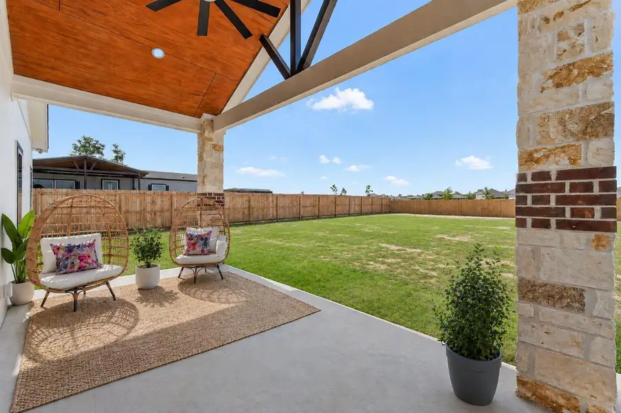 Oversized covered patio featuring a custom ceiling and ample space for outdoor entertaining. Oversized covered patio featuring a custom ceiling and ample space for outdoor entertaining.