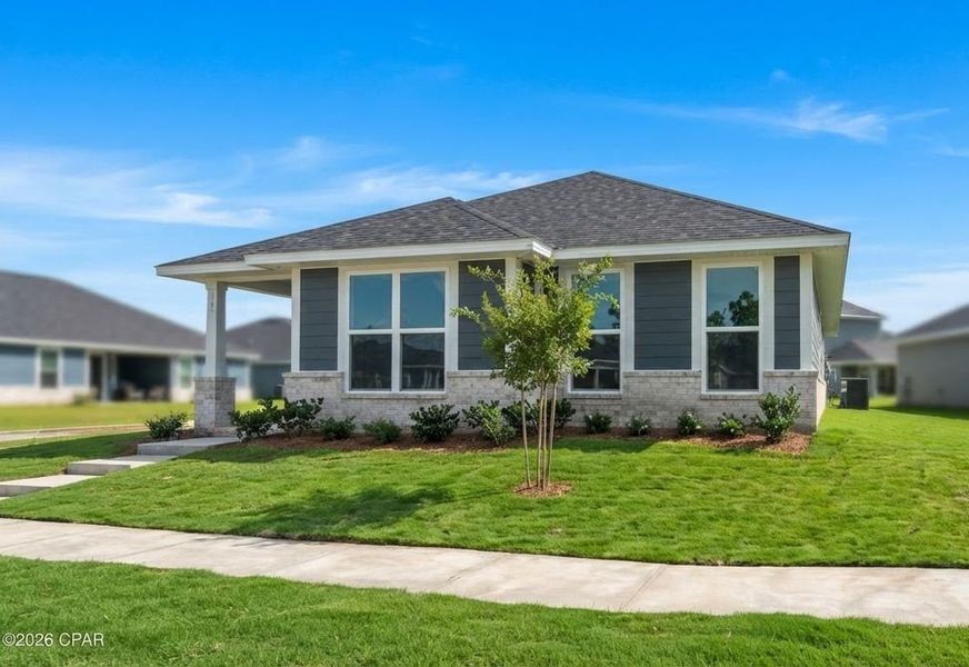 Front exterior of a new home in East Bay, Panama City, FL, highlighting curb appeal (Image 1). Front exterior of a new home in East Bay, Panama City, FL, highlighting curb appeal (Image 1).