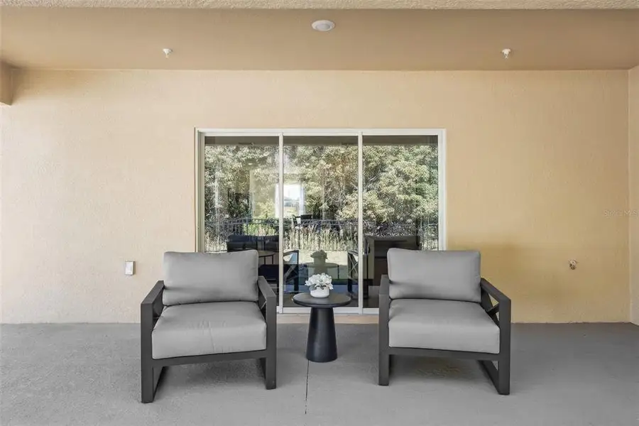 Exterior details and patio area of a home in Oak Pointe, Apopka (Image 2).