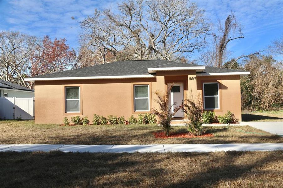 Front exterior of a new home in , Hudson, FL, highlighting curb appeal (Image 1). Front exterior of a new home in , Hudson, FL, highlighting curb appeal (Image 1).