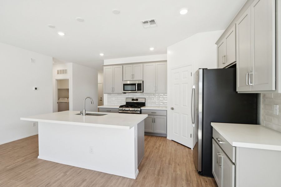 Kitchen featuring the Milan Collection. Finishes and options may vary by community.