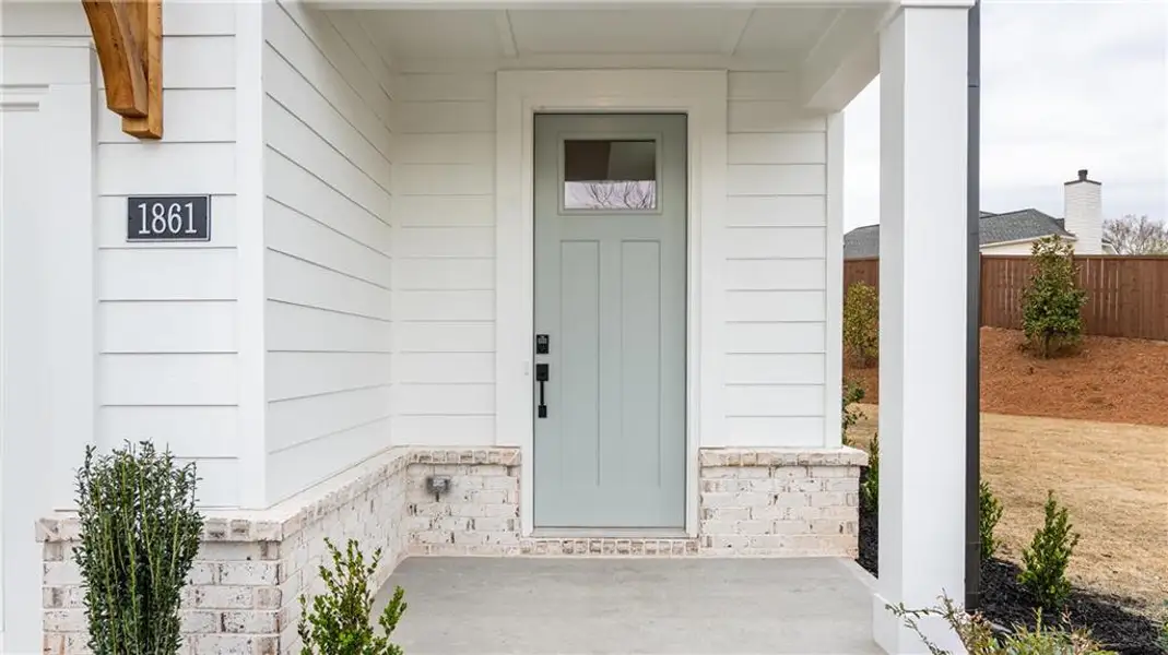 Exterior details and patio area of a home in The Village at Sandy Plains, Marietta (Image 3).